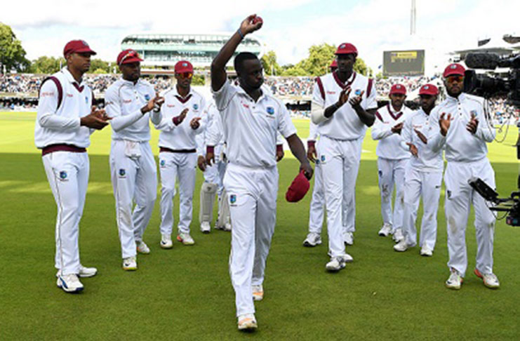 Fast bowler Kemar Roach acknowledges the adulation of the Lord’s crowd and his teammates following his five-wicket haul on Friday. (Photo courtesy CWI Media)