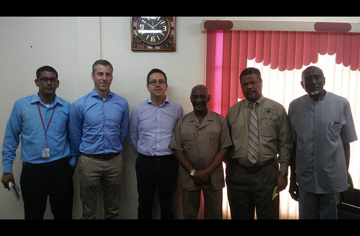 Minister within the Ministry of Social Protection, Keith Scott with officials of his ministry and representatives of the Royal BAM Group (Ministry of Social Protection photo)