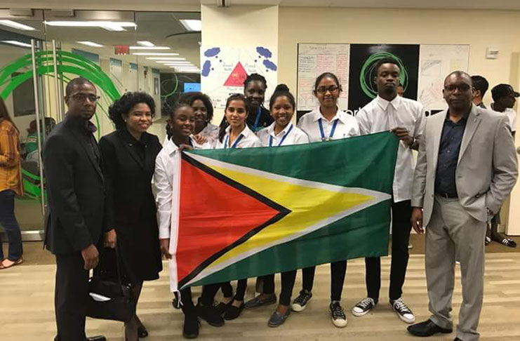 The youth ambassadors pose with the Golden Arrowhead and members of Guyana’s embassy in Washington D.C. after delivering their follow-on project presentation.