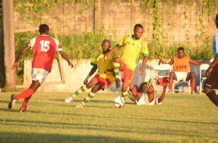 Part of the action between Beacon and Black Pearl in the GFA Premier League at the GFC ground on Sunday.