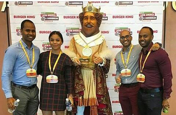 The Corum Group Guyana representatives and the Burger King mascot