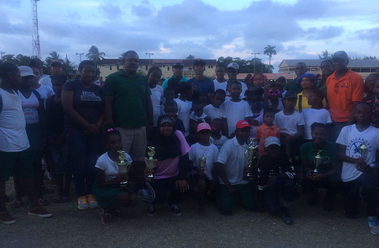 The winners of Commander-A Division Cricket tournament pose with their trophies. Albouystown picked up both the male and female title.