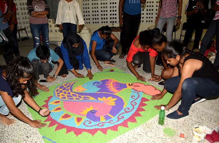 DIVERSITY! Team Bazodee, a participating team of Fifth Form students, join hands to create their Rangoli