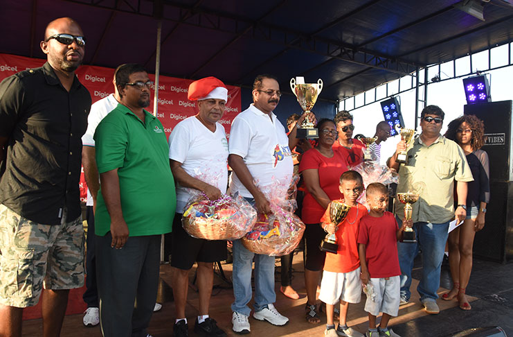 The winners with senior Digicel Guyana managers on Sunday (Photos by Adrian Narine)