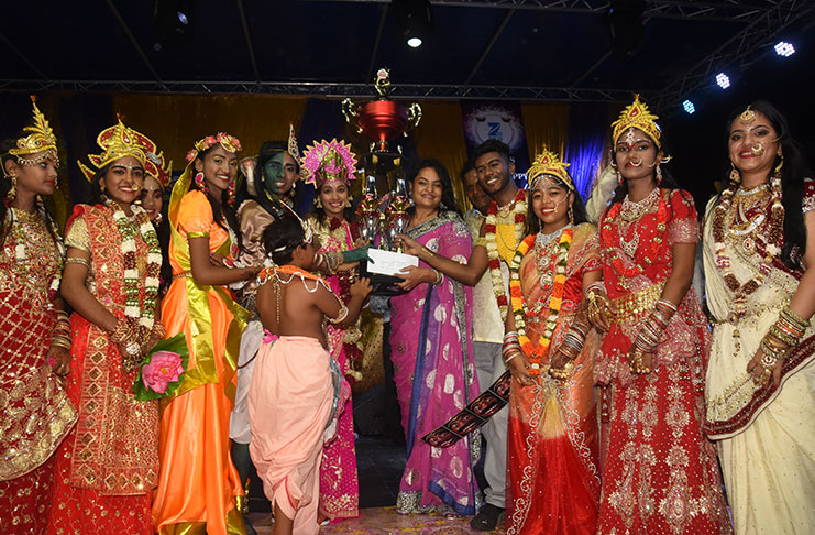 Representatives of the Golden Om Dharmic Youth Organisation collect their first place prize from President of the Guyana Hindu Dharmic Sabha (GHDS), Dr. Vindhya Persaud