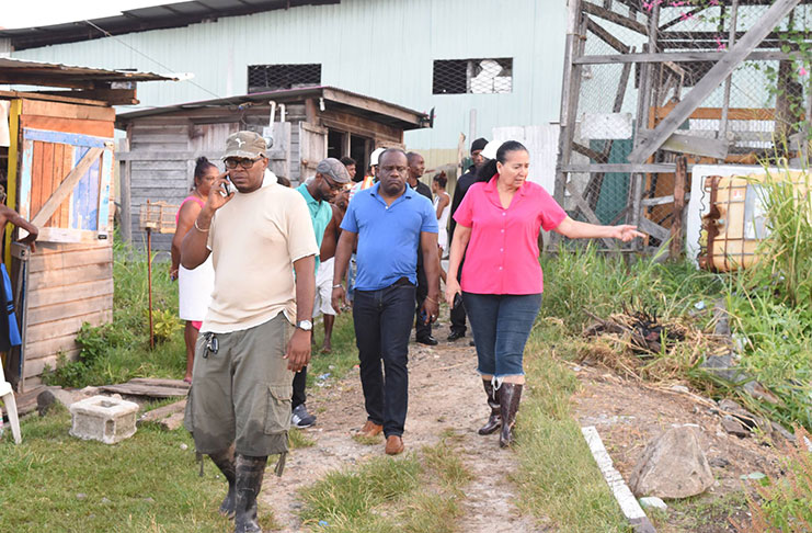 City Mayor Patricia Chase-Green, Town Clerk Royston King and other City Council members walked through Riverview Wednesday following the flooding of the community (Kawise Wishart photo)