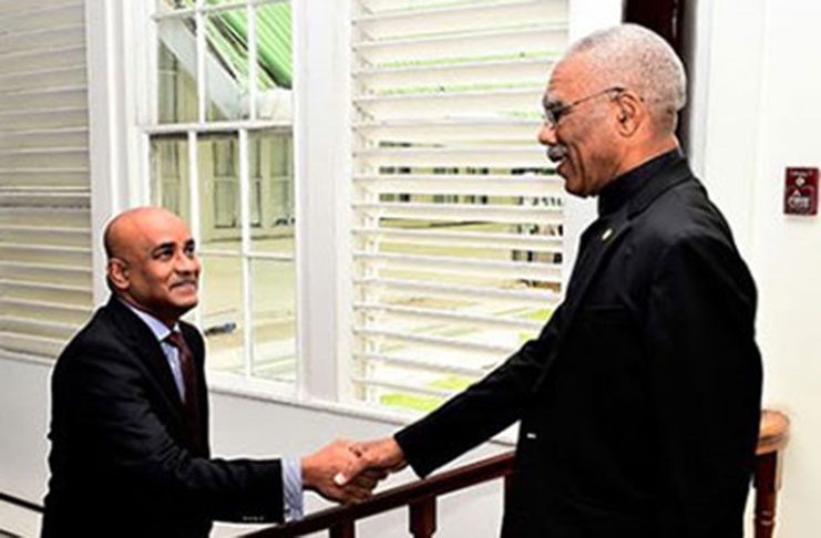 President David Granger greeting Leader of the Opposition Bharrat Jagdeo during one of the few meetings they have had. (File Photo)