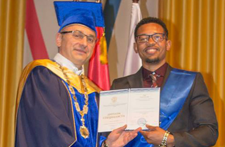 A humble Kollis Smith, receiving his certificate on graduation day after studying in Russia for six years. He is now a Specialist in Geological Engineering