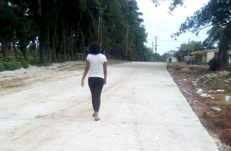 A resident walks along the all-weather road which was constructed at Mabaruma