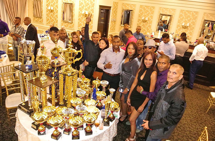 Dant players and supporters display part of their winnings.