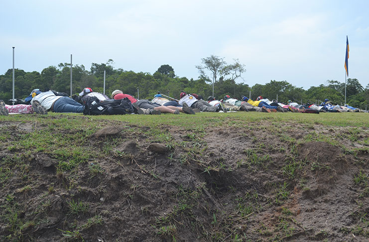 Shooters take their mark at the 900-yard bank of the Timehri Rifle Ranges yesterday. (Stephan Sookram photo)