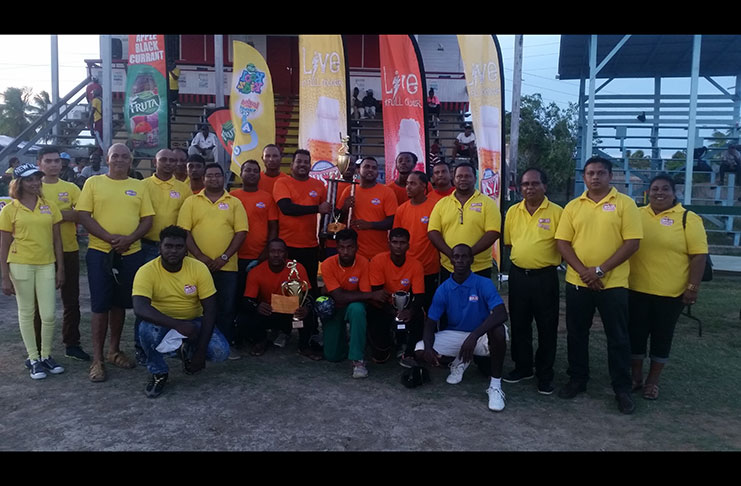 “The Winning Grill Master team celebrate with officials of the Guyana Beverage                       Company Inc”.