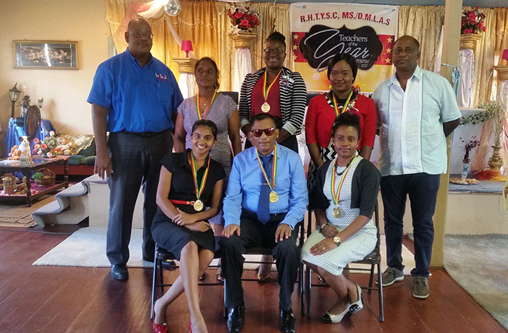 The six teachers pose with Mr. Clarence Perry of DMLAS and Mayor Vijai Ramoo