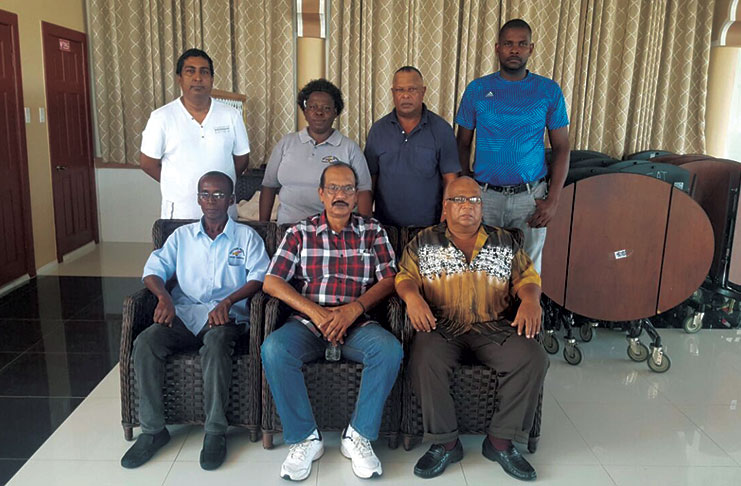 Dhierandranauth Somwaru (seated centre) is flanked by other executive members of the BCB after Sunday’s elections. Missing is Winston Roberts.