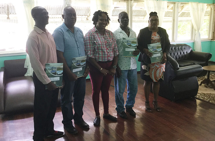Minister within the Ministry of Public Infrastructure, Annette Ferguson, poses with members of the new board of the Kwakwani Utility Cooperated