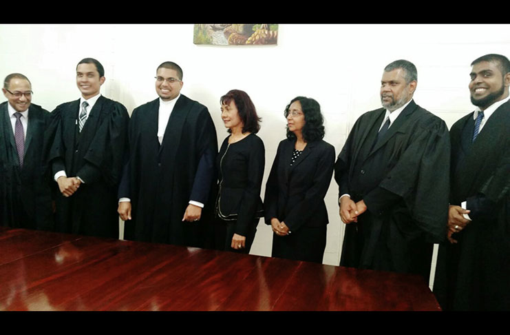 Rizwaun Mohamed second left with Senior Counsel Robin Stoby, Justice Nareshwar Harnanan, his mother Zareefa Mohamed, Justice Diana Insanally, Attorney Kashir Khan and Attorney Imtiaz Baig, following his admission to the Bar