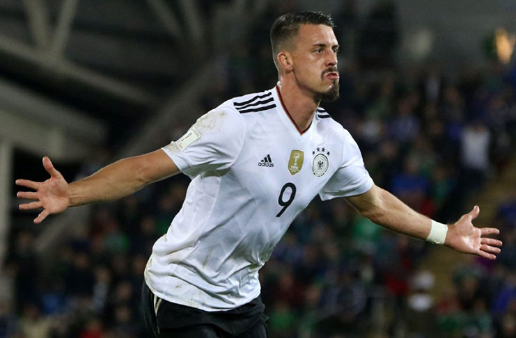 Sandro Wagner scores one of Germany's two first-half goals en route to a 3-1 win.