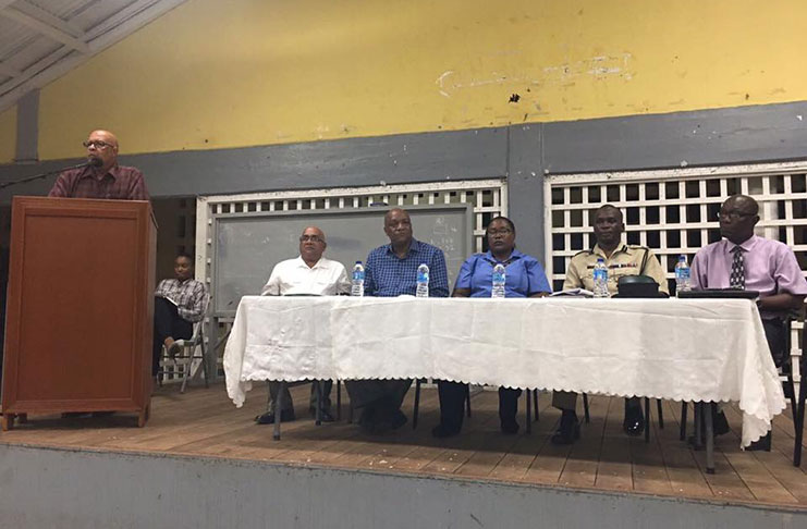 Guyana Water Incorporated (GWI) Chief Executive Officer, Dr. Richard Van- West Charles addressing the gathering at the West Demerara Secondary School as other members of the head table look on
