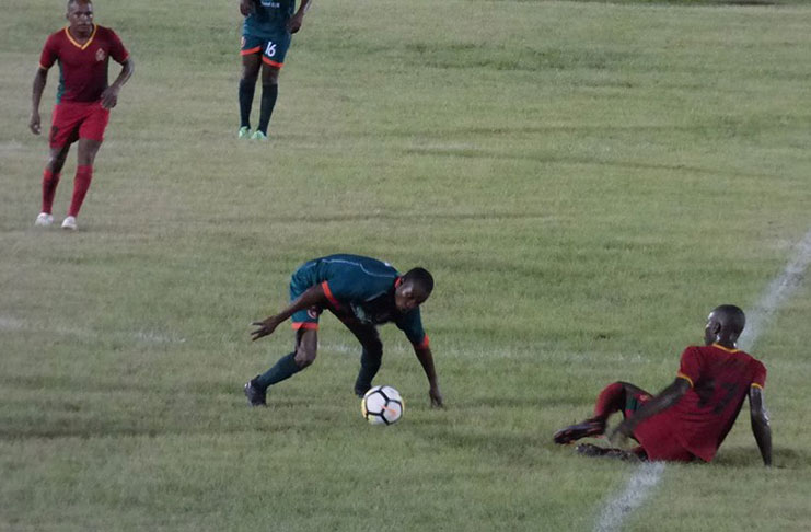 A GDF player (left) was left in ‘ruins’ by this Fruta Conquerors competitor during Sunday’s GFF ‘Big Four’ Final.