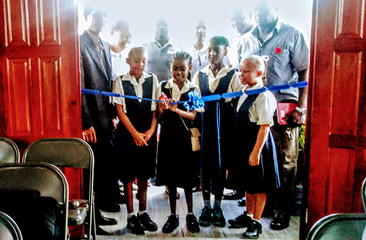 Children of Coomacka participating in the ribbon-cutting exercise to symbolise the opening of the resource centre