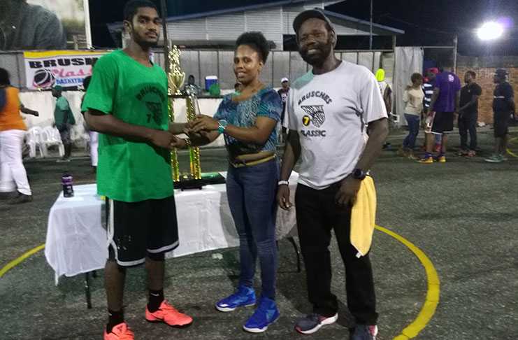 Akeem ‘The Dream’ Kanhai receives his MVP trophy from the organisers after helping the Jets defeat Ravens 55-44 at the MSC Hard Court.