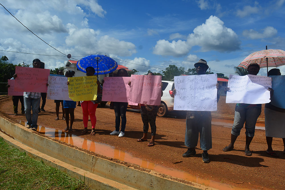 Protesters displaying their placards