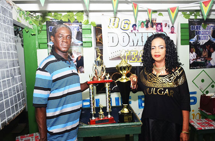 Senior organising secretary of the Georgetown Dominoes Association, Mark ‘Jumbie’ Wiltshire and GNDF president Faye Joseph pose with the trophies that will be up for grabs.