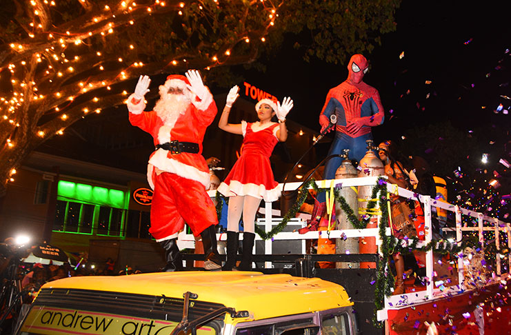 Santa and Mrs Claus making their grand entrance into a packed-to-capacity Main Street on Friday evening as furniture
giant, Courts Guyana Inc. hosted its 17th Annual Christmas Tree Light-up (Adrian Narine photo)