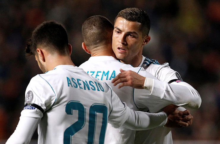 Real Madrid’s Karim Benzema celebrates scoring their fourth goal with Cristiano Ronaldo and Marco Asensio REUTERS/Yiannis Kourtoglou