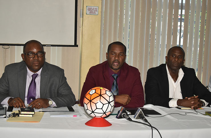 GFF president Wayne Forde, flanked by vice-presidents Rawlston Adams (first from left) and Bruce Lovell (first from right) at Saturday’s post-congress press conference. (Adrian Narine photo)