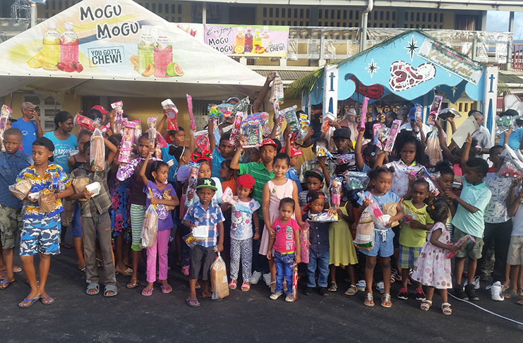 Some of the children attending the Christmas Party posed with their goody-bags and toys.