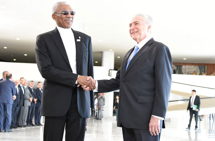 President David Granger is greeted by Brazil's President, His Excellency Michel Temer .