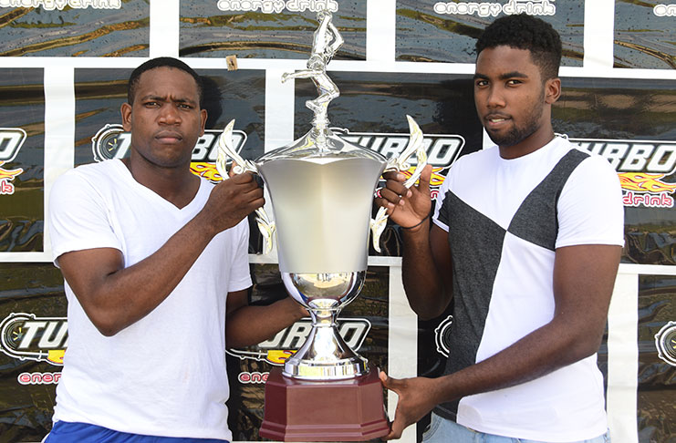 Who will lift the trophy? Police Captain Winston Tanner (right) and Camptown FC skipper, Lezhan Lord will battle for the Turbo Trophy tonight (Adrian Narine Photo)