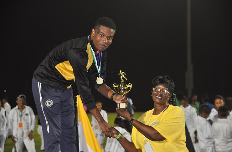 Daniel Williams receives his U-18 Champion Boy trophy. (Delano Williams photo)