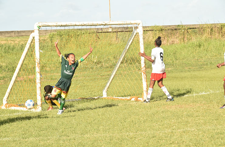 Fayon Harry celebrates after scoring the first of two goals for her team.