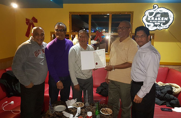 OMSCC president Azeem Khan hands over the certificate to Frederick Halley. Others in picture (from left) are treasurer Feizal Bacchus, secretary Khem Singh and Over-50 coordinator, Dickey Singh.