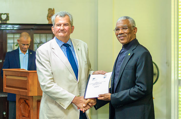 British Senior Security Sector Reform Adviser, Lt Col (ret’d) Russell Combe presenting President David Granger with the Report
on the Security Sector Reform Programme (SSRP) (Delano Williams’ Photo)