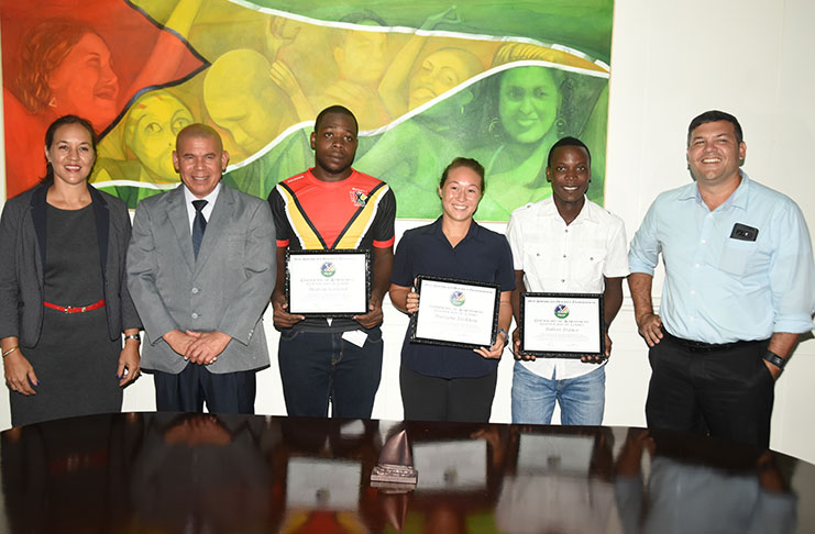 From L-R, GHB secretary Tricia Fiedtkou stands with Minister with responsibility for Sport Dr George Norton, Pan American Men’s All Star player Medroy Scotland, Women’s All Star Marzana Fiedtkou, Men’s All Star Robert France and president of the Guyana Hockey Board Philip Fernandes (Adrian Narine photo)