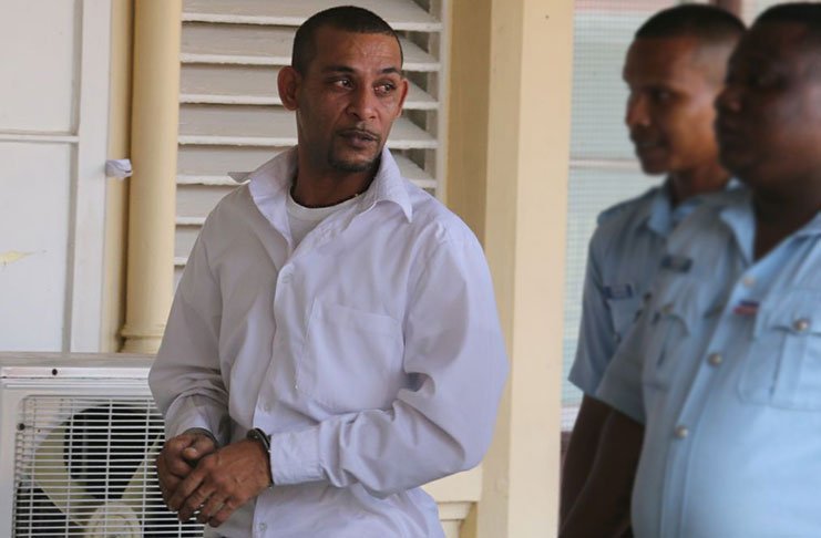 Sentenced to 70 years: Rajesh Guyadeen, in white shirt