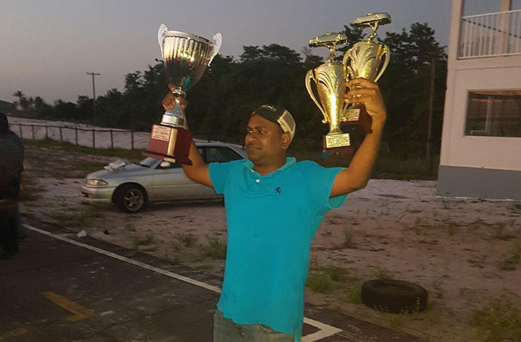 Anand Ramchand displays his winning trophies.