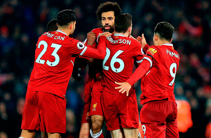 Liverpool's Mohamed Salah (centre) celebrates with team-mates after scoring his team's fourth goal .