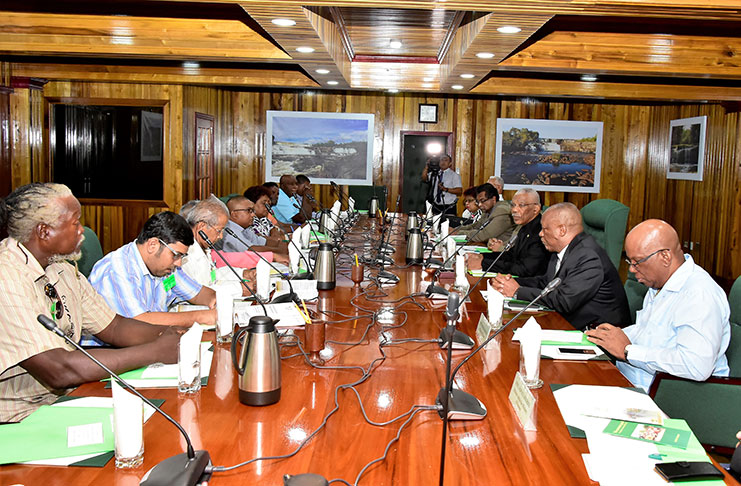 President David Granger addresses representatives of GAWU and NAACIE on Friday in the presence of several of his senior cabinet ministers at the Ministry of the Presidency. (MoTP photo)