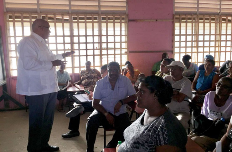 Dr. Richard Van West-Charles addressing residents at Sheet Anchor, Berbice