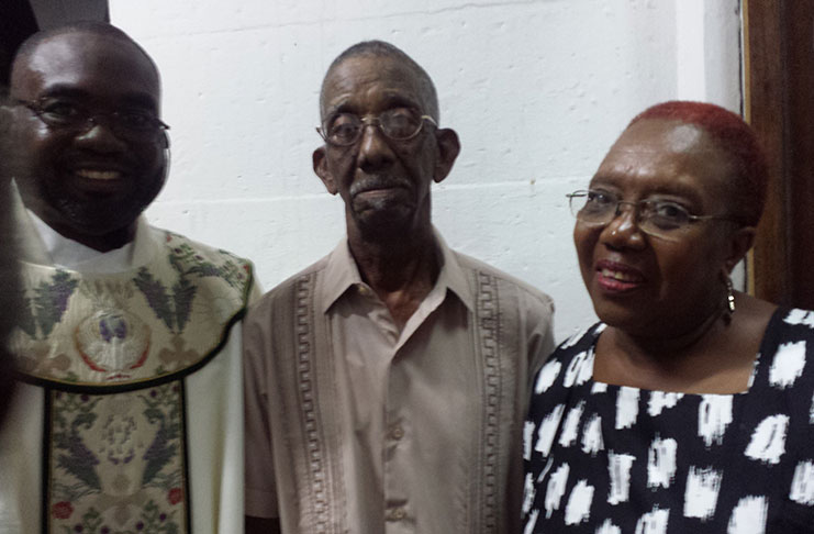 Father Carl Philadelphia and parents Kenneth and Patricia Anne Mitchell