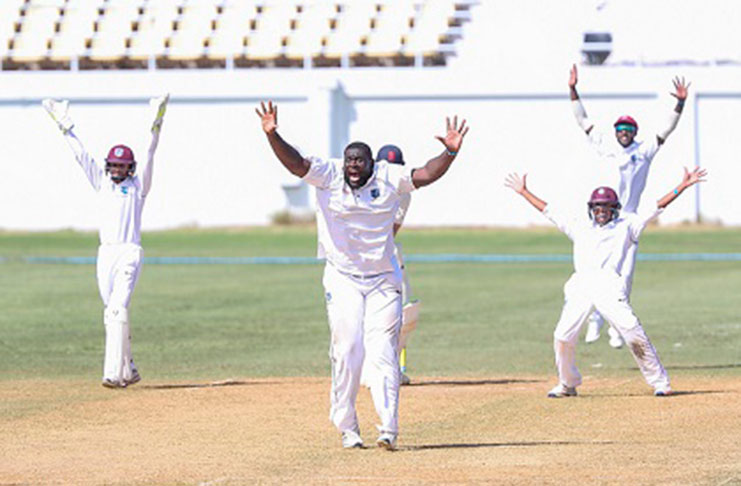 Off-spinner Rahkeem Cornwall appeals successfully for an lbw decision against Nick Gubbins (partially hidden). (Photo courtesy CWI Media)
