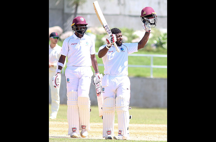 Raymon Reifer shares in the delight of Jahmar Hamilton reaching 100 on the second day of the second ‘Test’ between Windies-A and England Lions yesterday at Sabina Park.  Reifer fell for 95 (CWI Media/Athelstan Bellamy).