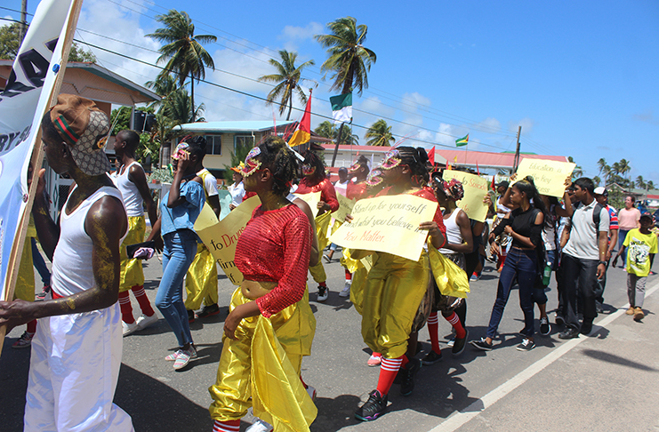 Revellers marching down the road