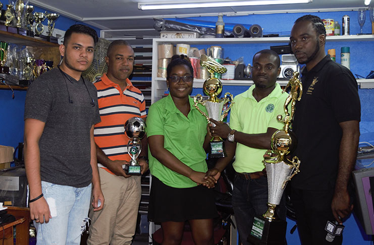 Legacy Promotions, Lomel Johnson receives the championship trophy at the simple handing over ceremony