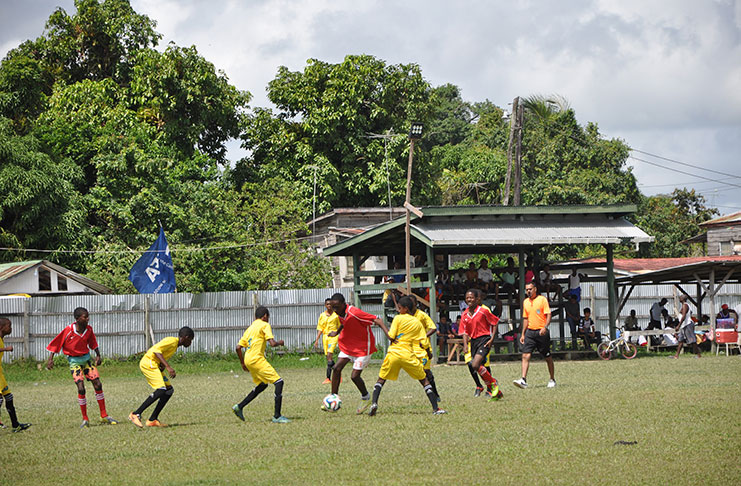 This Agricola Red Triangle player is caught heading the ball away in their clash with Diamond United on Sunday.