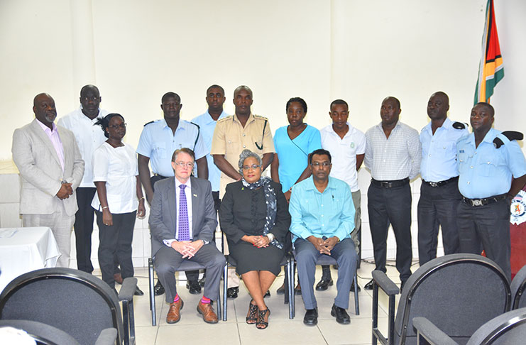 (L-R seated) Acting British High Commissioner Ron Rimmer, Director and facilitator Caroline Ravello, Minister of Public Security, Khemraj Ramjattan and standing behind at the center Prisons Director (ag) Gladwin Samuels flanked by participants of the programme (Samuel Maughn Photo)